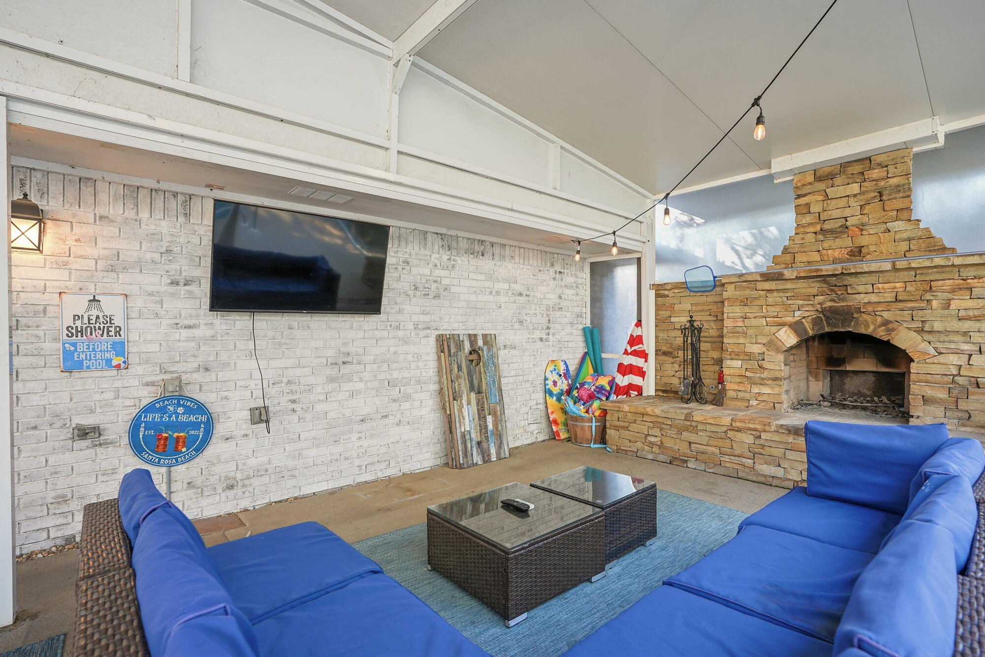 18 Initial Lane Santa Rosa Beach, FL 32459 - Photo 43 of 60 a living room with furniture and a fireplace