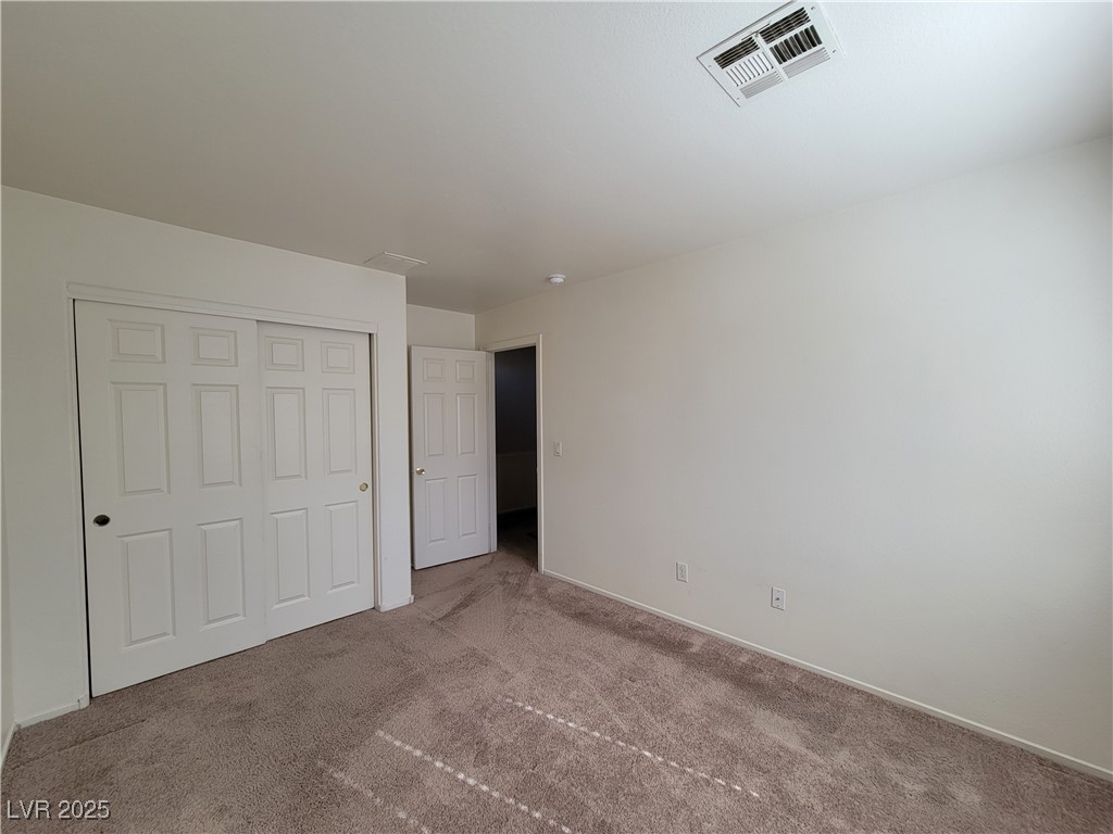 1112 Nevada Blaze Avenue North Las Vegas, NV 89081 - Photo 16 of 22 Unfurnished bedroom with carpet floors and a closet