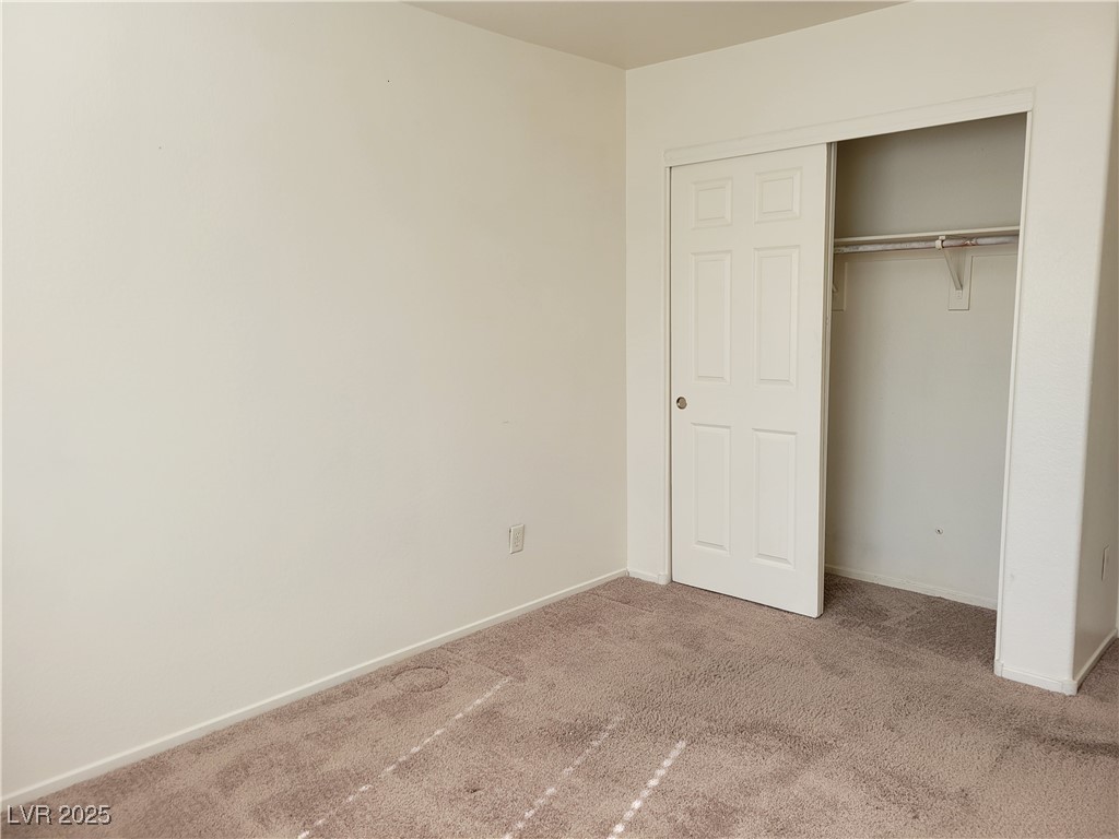 1112 Nevada Blaze Avenue North Las Vegas, NV 89081 - Photo 18 of 22 Unfurnished bedroom with carpet flooring and a closet