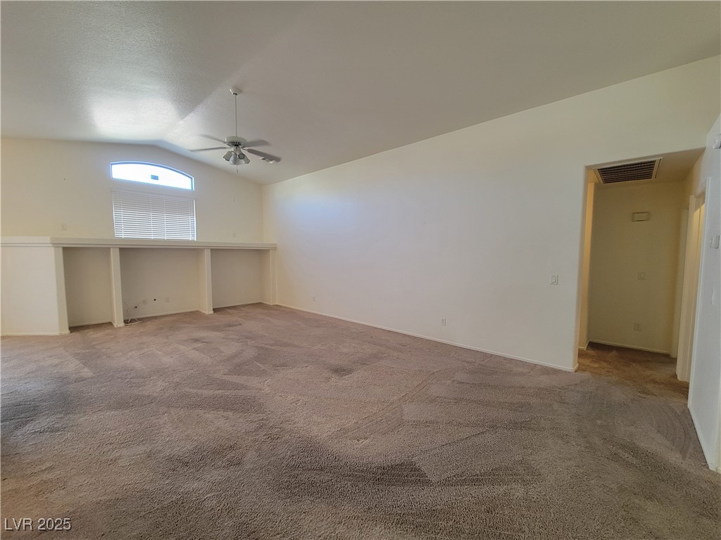 1112 Nevada Blaze Avenue North Las Vegas, NV 89081 - Photo 7 of 22 Bonus room with light carpet, lofted ceiling, and ceiling fan