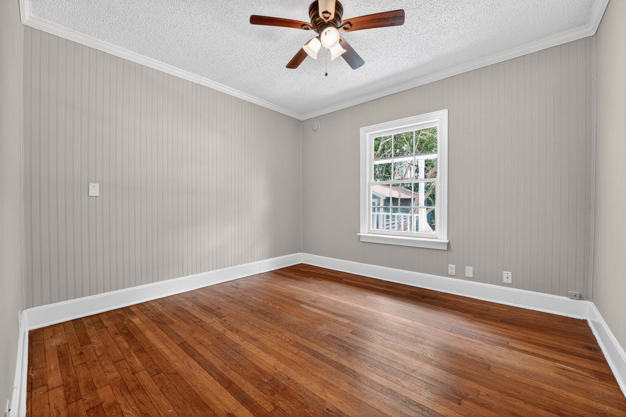 4907 Duval Street Austin, TX 78751 - Photo 29 of 31 a view of an empty room with wooden floor and a window