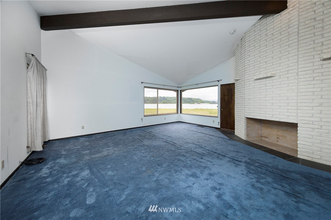 7461 Willow Grove Road Longview, WA 98632 - Photo 25 of 31 a view of an empty room with a fireplace and a window