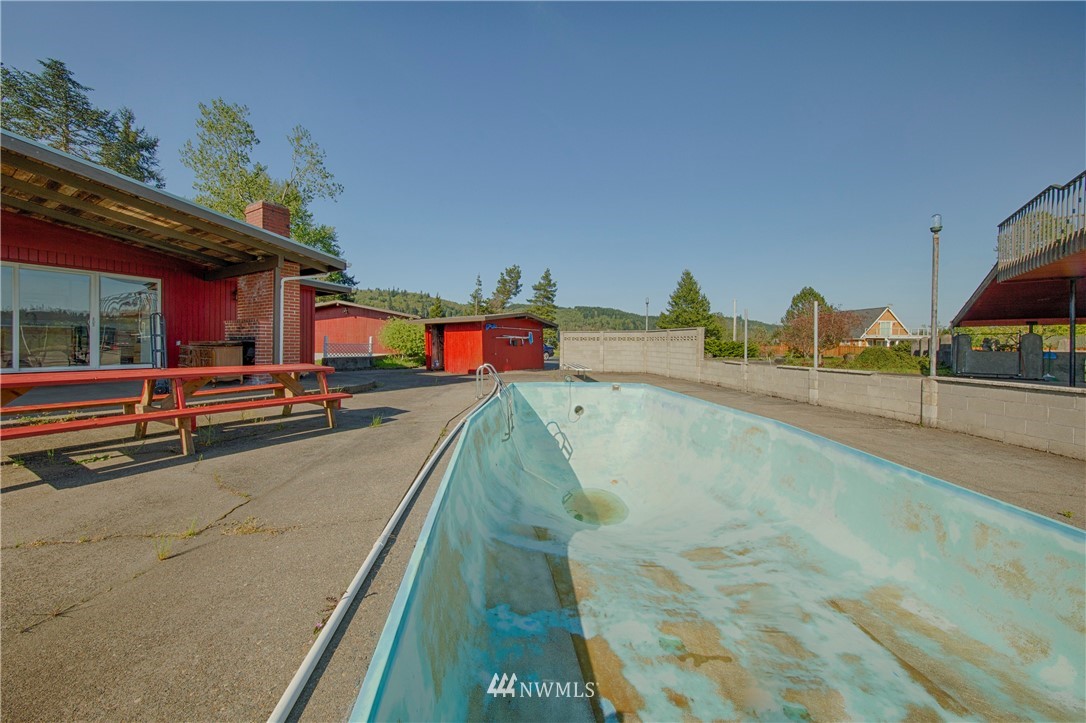 7461 Willow Grove Road Longview, WA 98632 - Photo 10 of 31 a view of a swimming pool with a lounge chair
