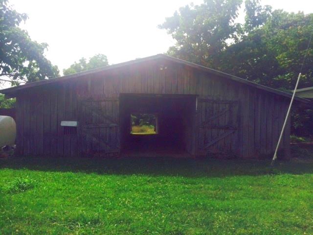 211 Hanna Road Prospect, TN 38477 - Photo 6 of 6 There are a couple of barns and an equipment shed.