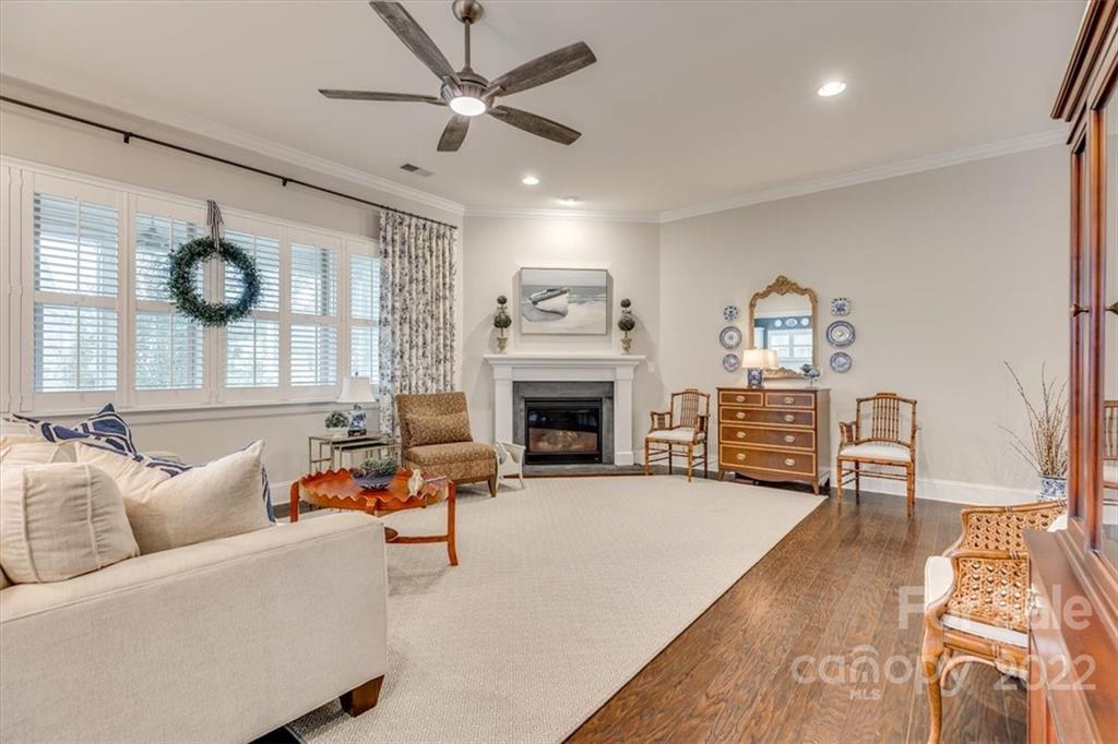 1489 Afton Way Fort Mill, SC 29708 - Photo 11 of 48 a living room with furniture a fireplace and a flat screen tv