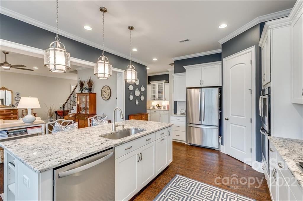 1489 Afton Way Fort Mill, SC 29708 - Photo 14 of 48 a kitchen with stainless steel appliances granite countertop a sink refrigerator and cabinets
