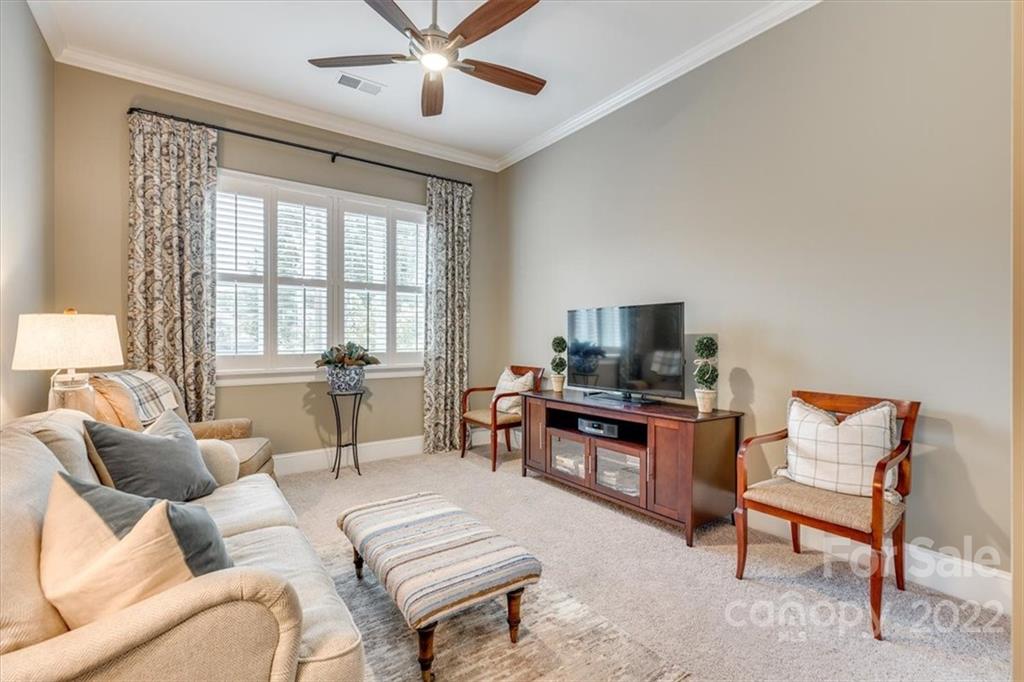1489 Afton Way Fort Mill, SC 29708 - Photo 18 of 48 a living room with furniture a flat screen tv and a window