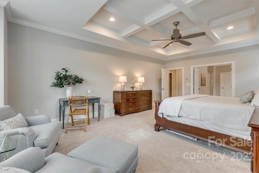 1489 Afton Way Fort Mill, SC 29708 - Photo 24 of 48 a spacious bedroom with a bed and a chandelier