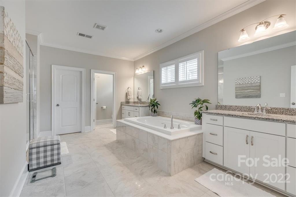1489 Afton Way Fort Mill, SC 29708 - Photo 25 of 48 a spacious bathroom with a tub sink and mirror