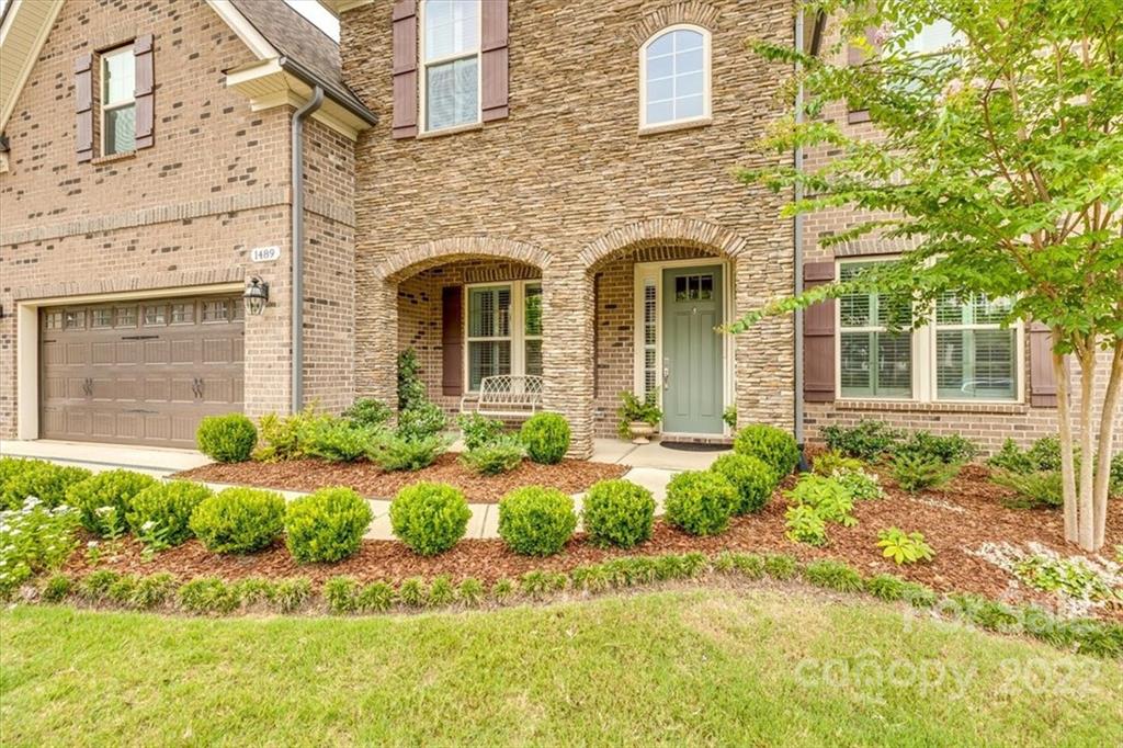 1489 Afton Way Fort Mill, SC 29708 - Photo 3 of 48 front view of a brick house with a yard