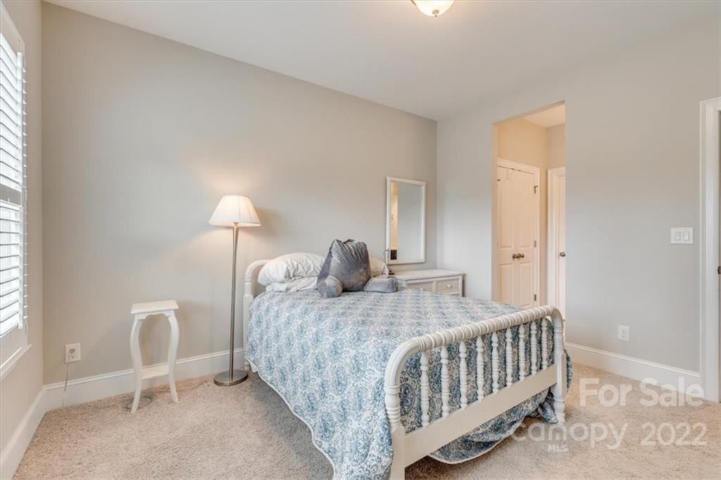 1489 Afton Way Fort Mill, SC 29708 - Photo 35 of 48 a bedroom with a bed and a chair