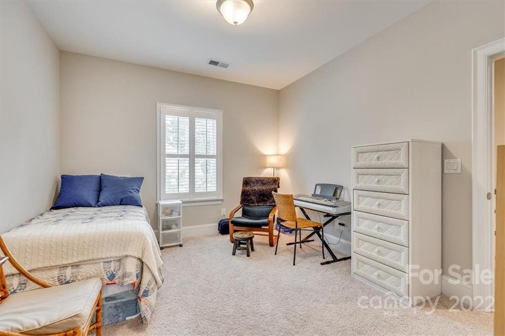 1489 Afton Way Fort Mill, SC 29708 - Photo 37 of 48 a bedroom with furniture and a window