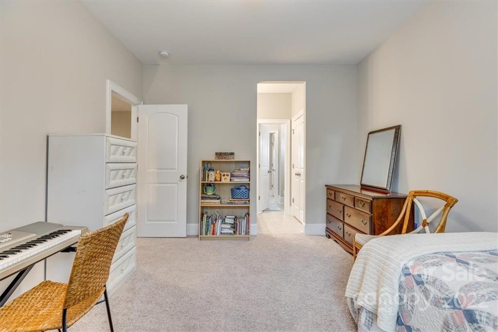 1489 Afton Way Fort Mill, SC 29708 - Photo 38 of 48 a bedroom with a bed and a chair in it