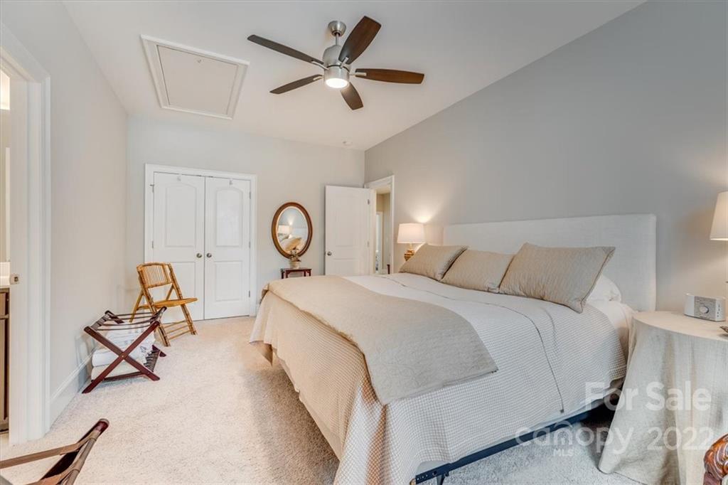 1489 Afton Way Fort Mill, SC 29708 - Photo 41 of 48 a spacious bedroom with a bed and a chandelier