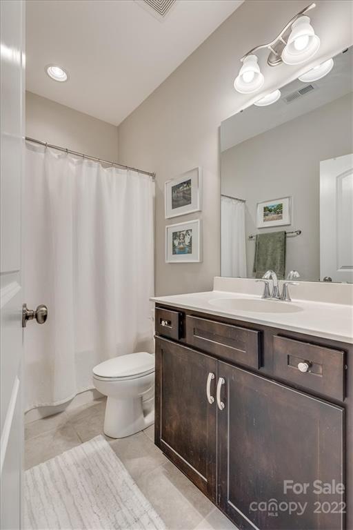 1489 Afton Way Fort Mill, SC 29708 - Photo 42 of 48 a bathroom with a granite countertop sink a toilet and a mirror