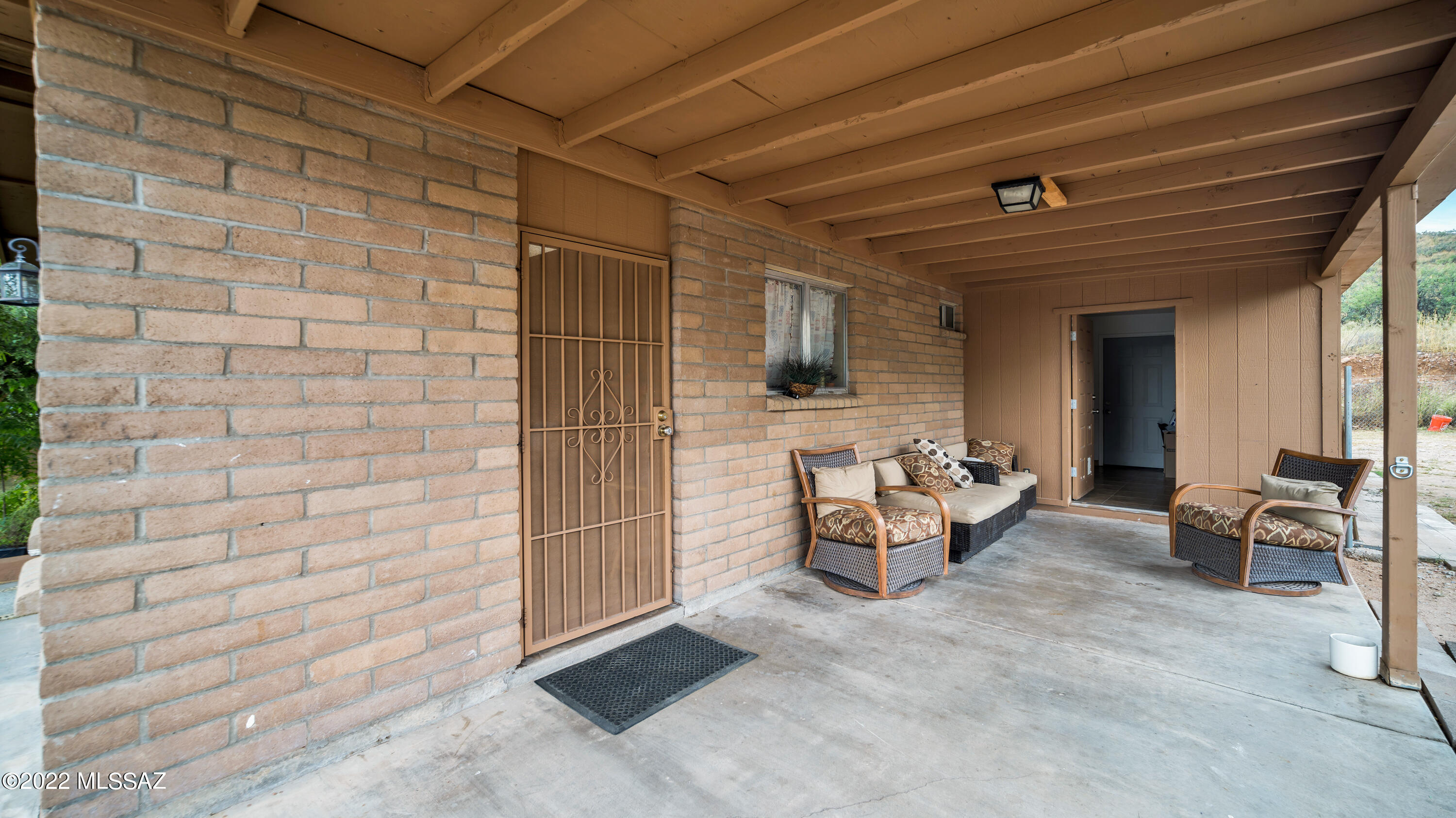 434 Paseo Flamenco Rio Rico, AZ 85648 - Photo 23 of 27 a view of a patio with dining table and chairs with couches