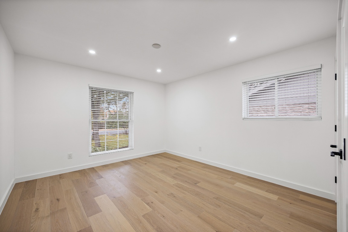 4609 Cliffstone Cove Austin, TX 78735 - Photo 17 of 33 Unfurnished room featuring light wood-type flooring and recessed lighting