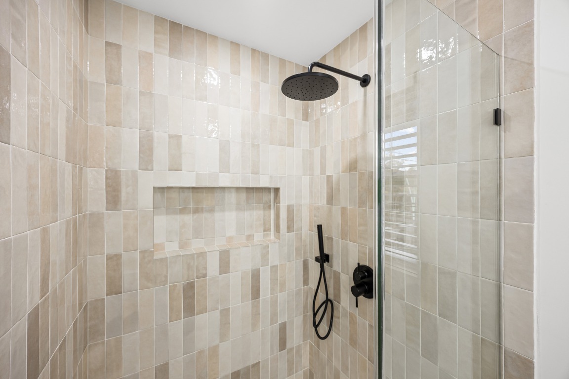4609 Cliffstone Cove Austin, TX 78735 - Photo 25 of 33 Full bathroom featuring a tile shower