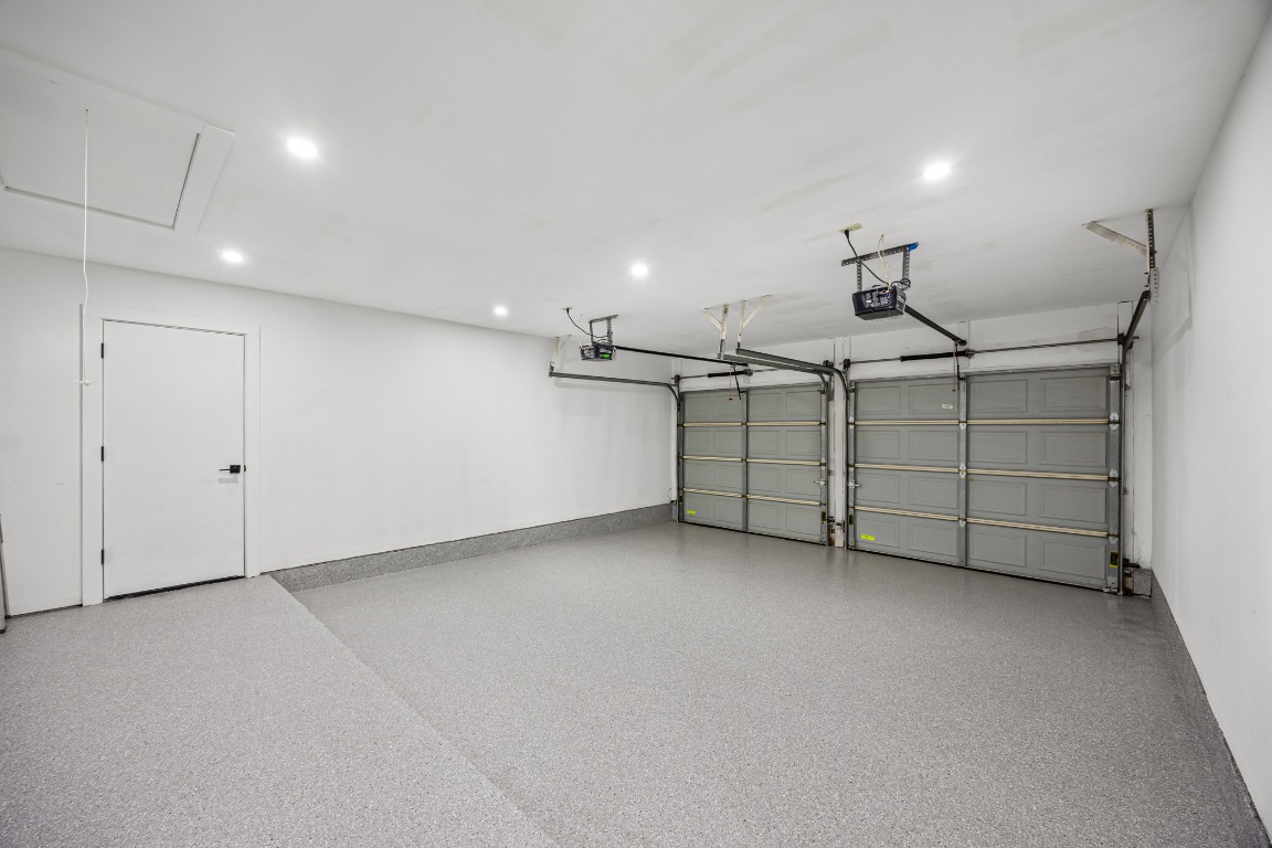 4609 Cliffstone Cove Austin, TX 78735 - Photo 28 of 33 Garage featuring recessed lighting and baseboards