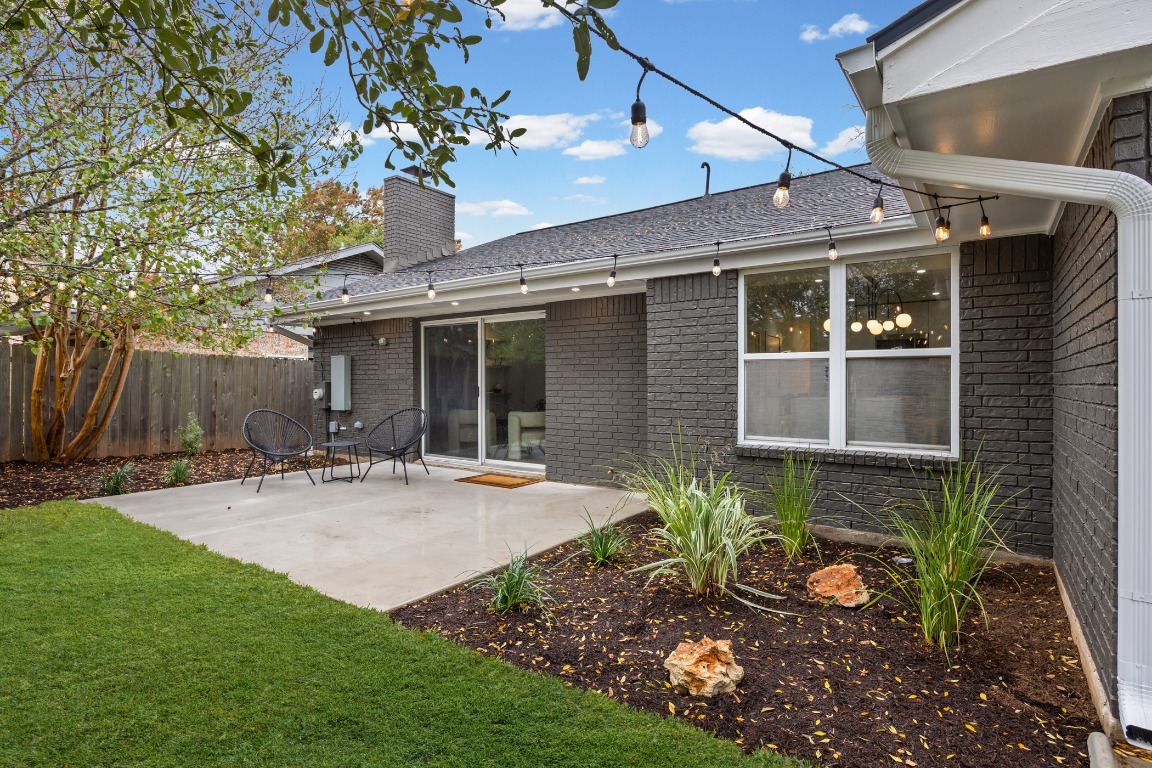 4609 Cliffstone Cove Austin, TX 78735 - Photo 31 of 33 Rear view of house featuring brick siding, a patio area, and a chimney