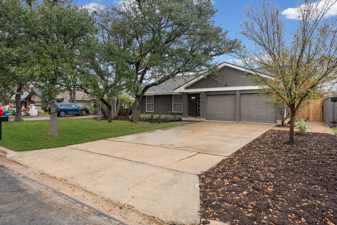 4609 Cliffstone Cove Austin, TX 78735 - Photo 33 of 33 Single story home featuring concrete driveway, an attached garage, and brick siding