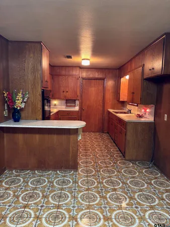 a bathroom with a bathtub and window