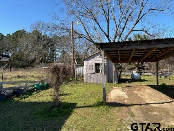 a bathroom with a granite countertop shower and a sink