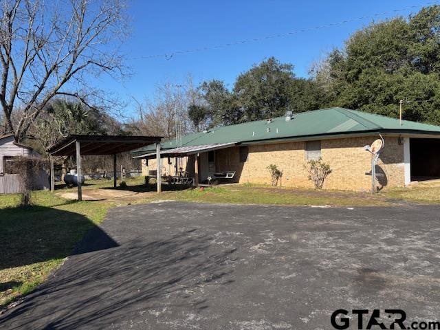 152 County Road 2131 Rusk, TX 75785 - Photo 19 of 43 a front view of a house with a yard and garage