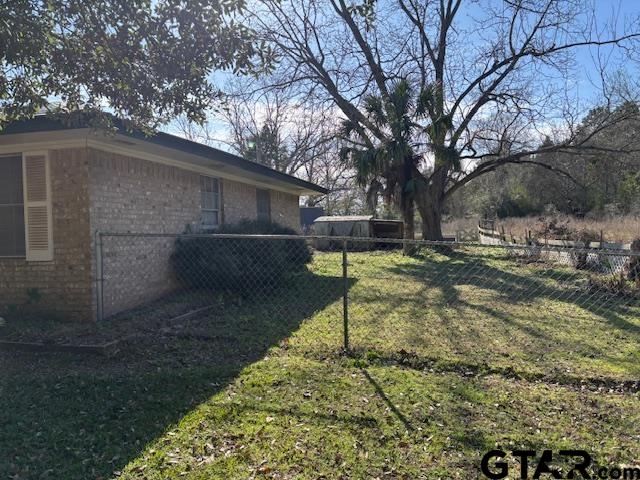 152 County Road 2131 Rusk, TX 75785 - Photo 3 of 43 a backyard of a house with barbeque oven table and chairs