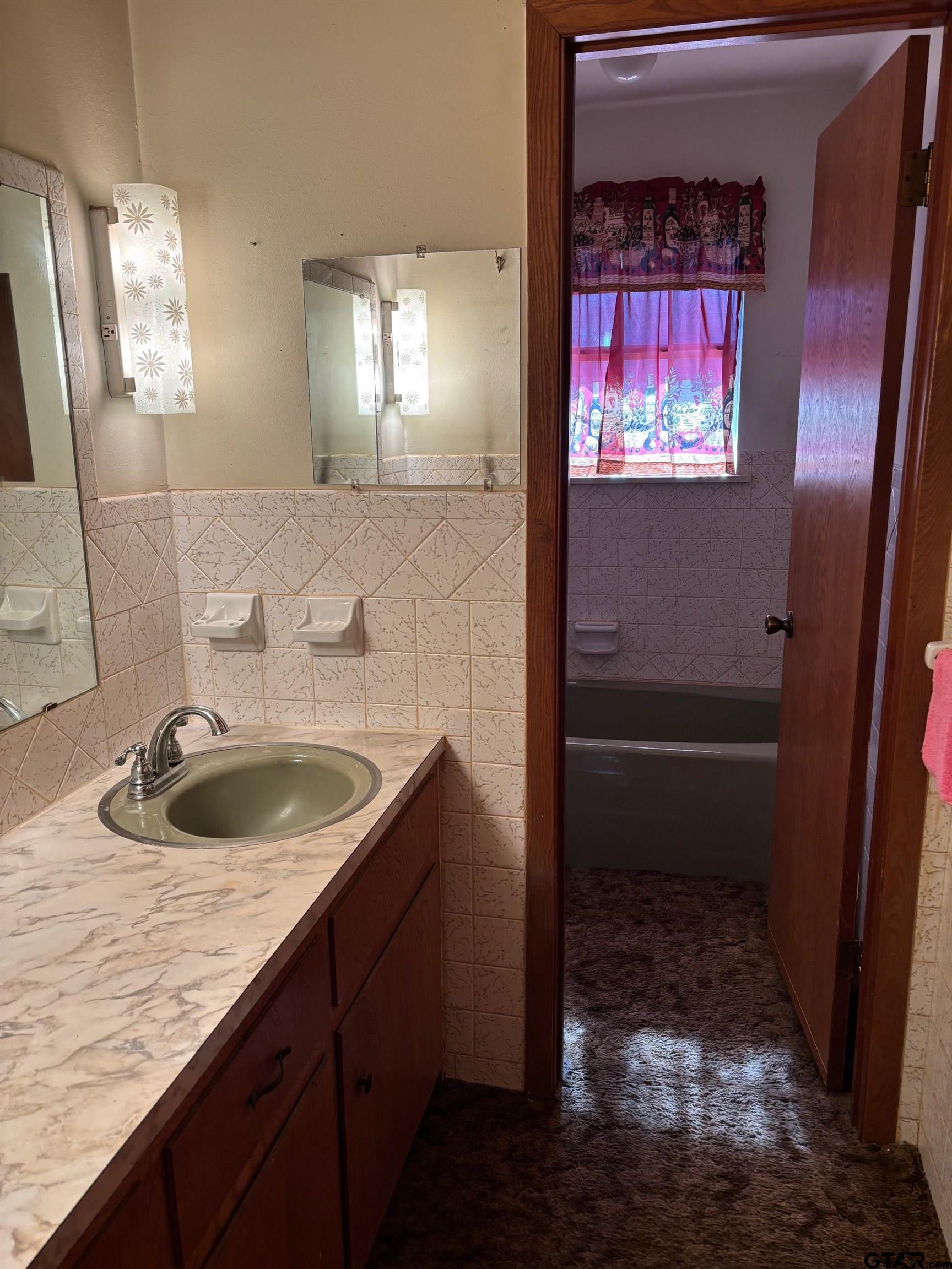 152 County Road 2131 Rusk, TX 75785 - Photo 40 of 43 a bathroom with a sink a toilet and mirror