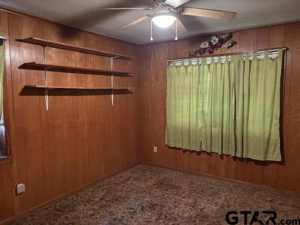 a view of storage and utility room with a window