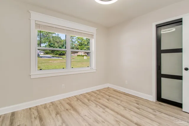 a view of an empty room with a window