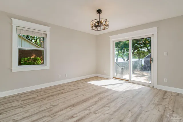 a view of an entryway with wooden floor