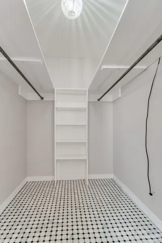 a bathroom with a sink toilet mirror and vanity