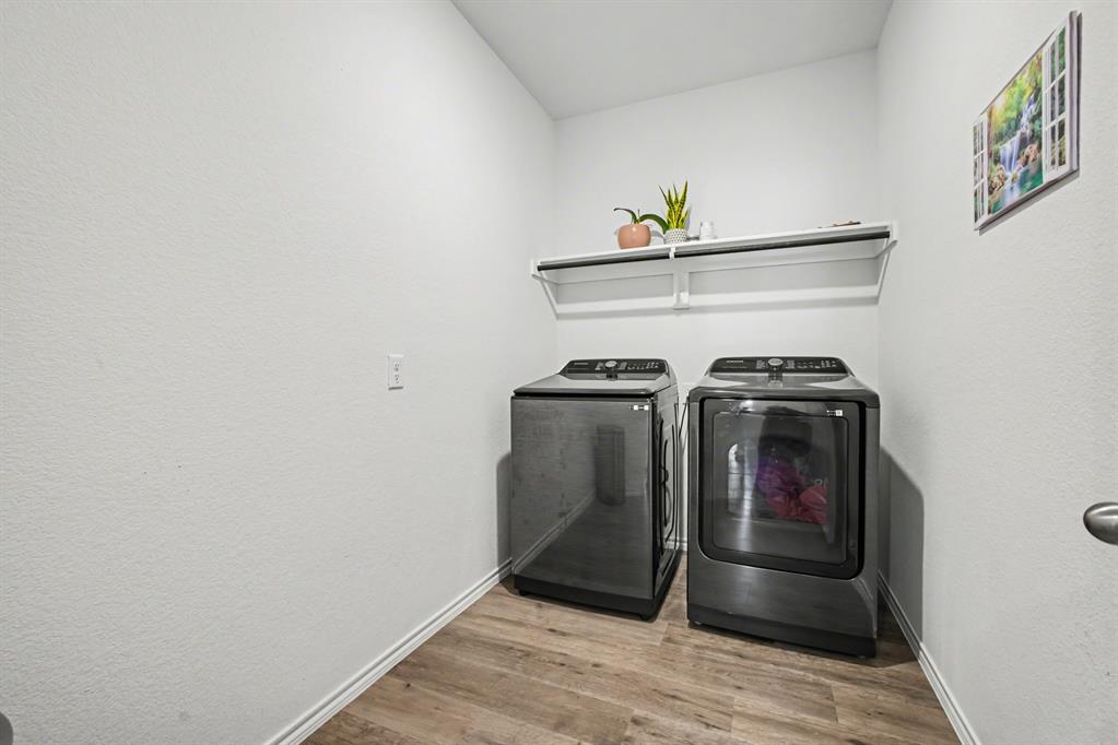 1301 Draper Lane Forney, TX 75126 - Photo 17 of 33 a utility room with dryer and washer