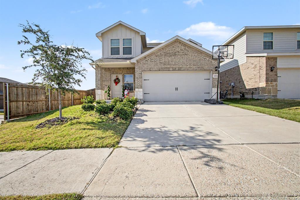 1301 Draper Lane Forney, TX 75126 - Photo 2 of 33 a front view of a house with a yard and potted plants