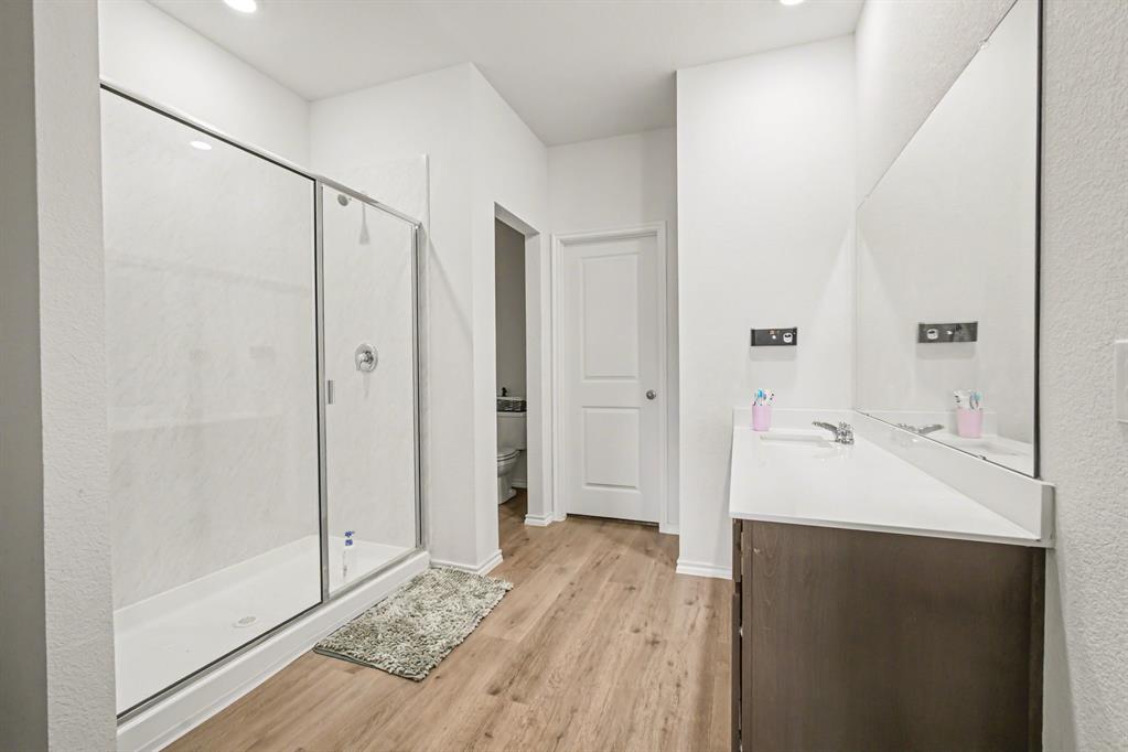 1301 Draper Lane Forney, TX 75126 - Photo 21 of 33 a bathroom with a sink and a mirror