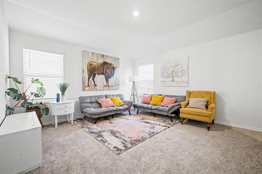 1301 Draper Lane Forney, TX 75126 - Photo 24 of 33 a living room with furniture and a window