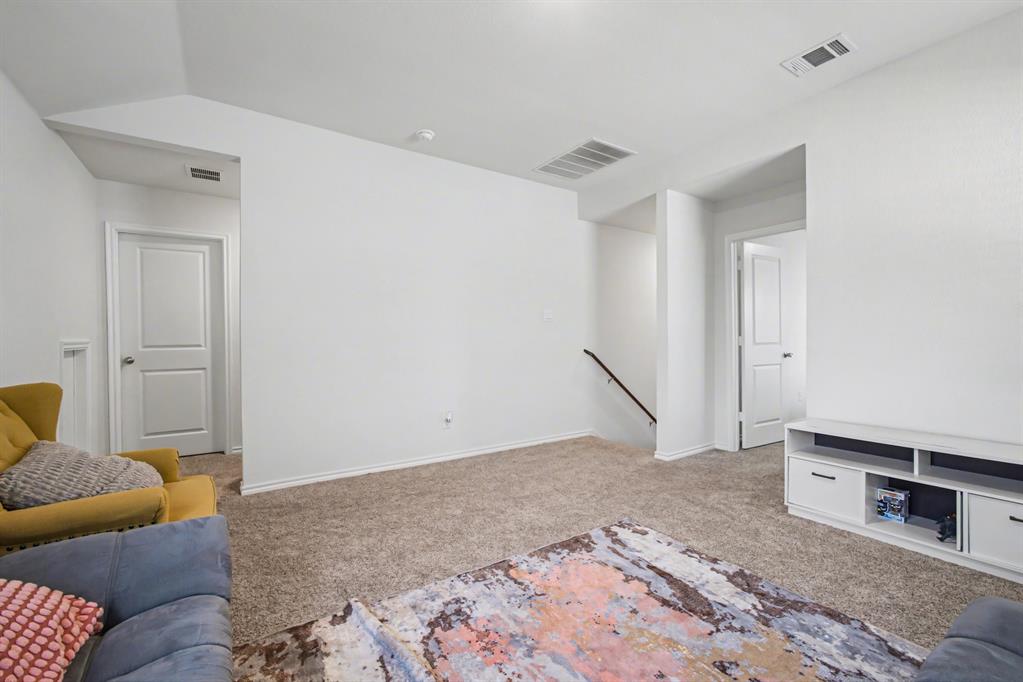 1301 Draper Lane Forney, TX 75126 - Photo 25 of 33 a living room with a couch