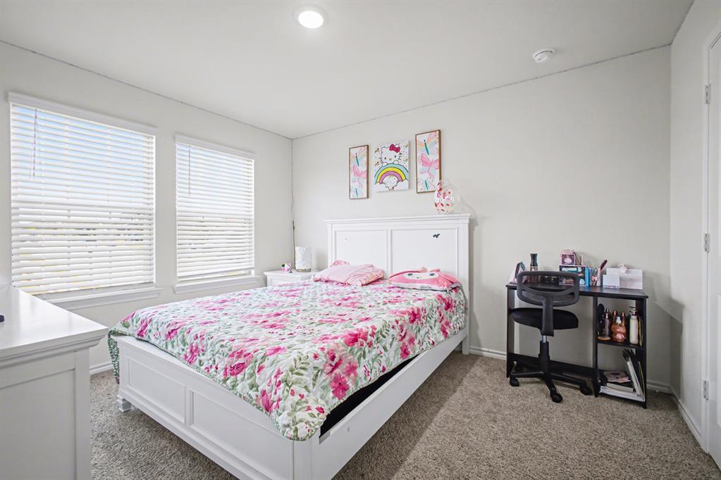 1301 Draper Lane Forney, TX 75126 - Photo 26 of 33 a bedroom with a bed and a desk