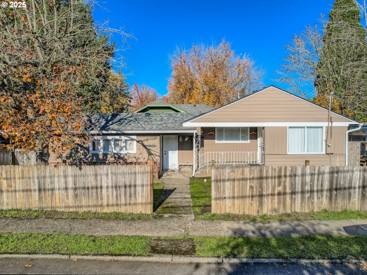 12025 Southwest 9th Street Beaverton, OR 97005 - Photo 13 of 22 a front view of a house with a garden