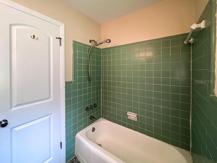 3920 Southwest 21st Street Gainesville, FL 32608 - Photo 26 of 40 a bathroom with a bathtub and shower