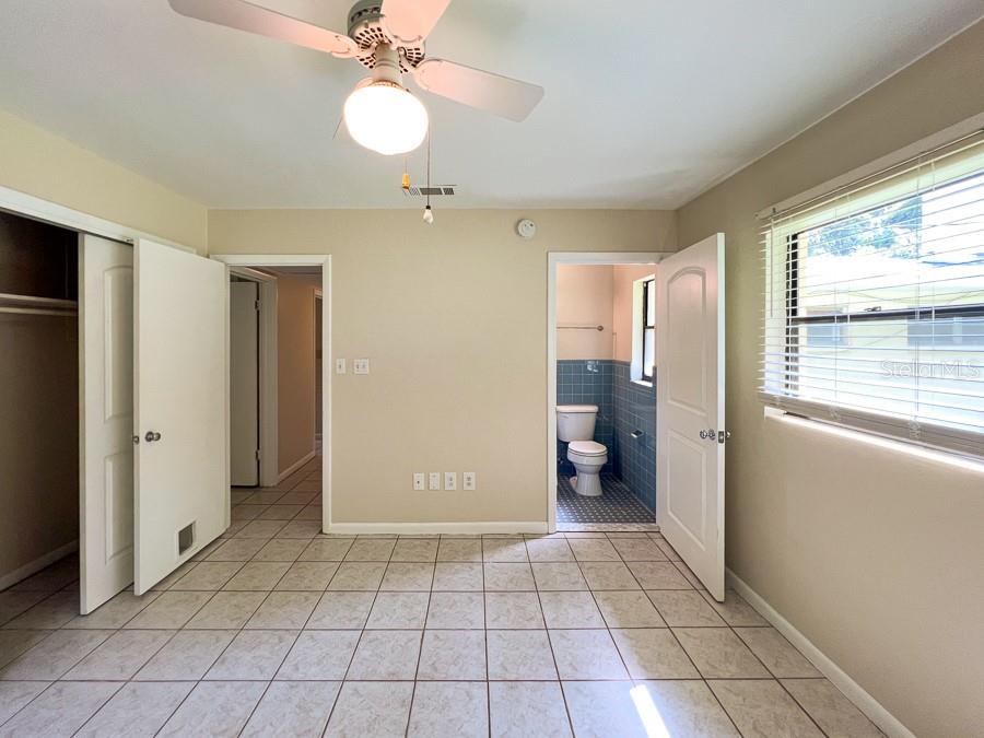 3920 Southwest 21st Street Gainesville, FL 32608 - Photo 31 of 40 a view of an empty room and a window