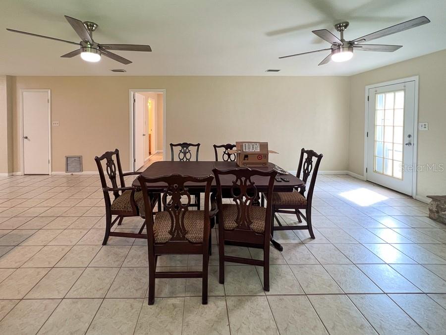 3920 Southwest 21st Street Gainesville, FL 32608 - Photo 7 of 40 a view of a dining room with furniture