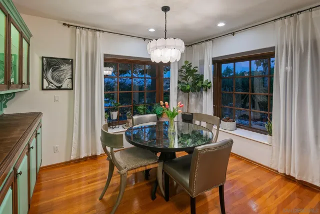 a view of a chairs and table on the wooden deck