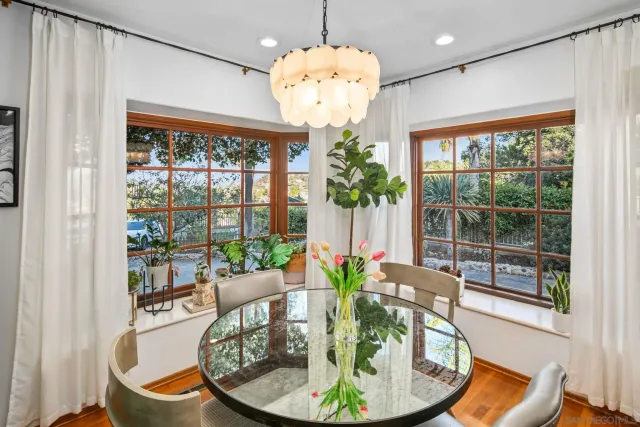 a view of a house with pool yard and sitting area