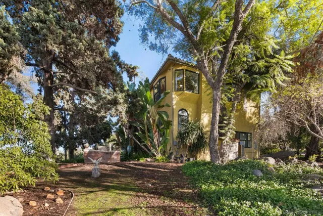a living room with a couch and a wooden floor