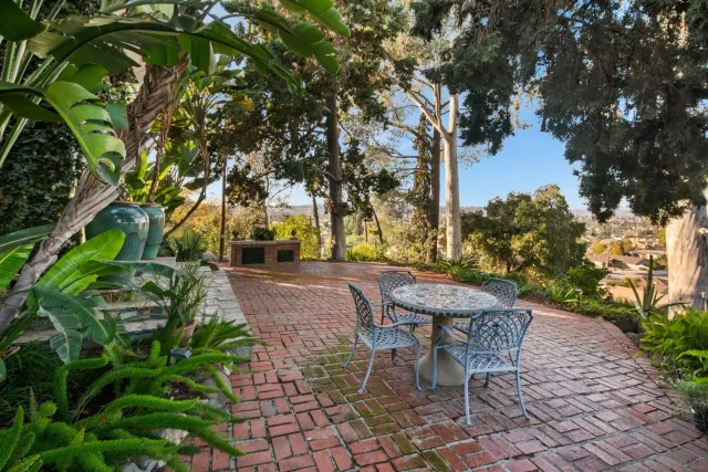 a living room with furniture and a book shelf