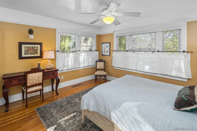 a bedroom with a bed and a fireplace