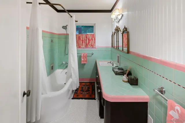 a spacious bedroom with a bed and glass door